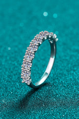 1 Carat Moissanite Half-Eternity Ring in rhodium-plated 925 sterling silver featuring sparkling round-cut moissanite stones along a polished silver band.