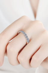 1 Carat Moissanite Half-Eternity Ring in rhodium-plated 925 sterling silver featuring sparkling round-cut moissanite stones along a polished silver band.