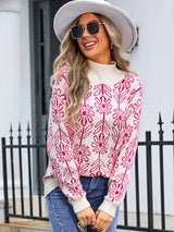 Women’s deep red and white floral turtleneck long sleeve sweater with allover flower pattern.