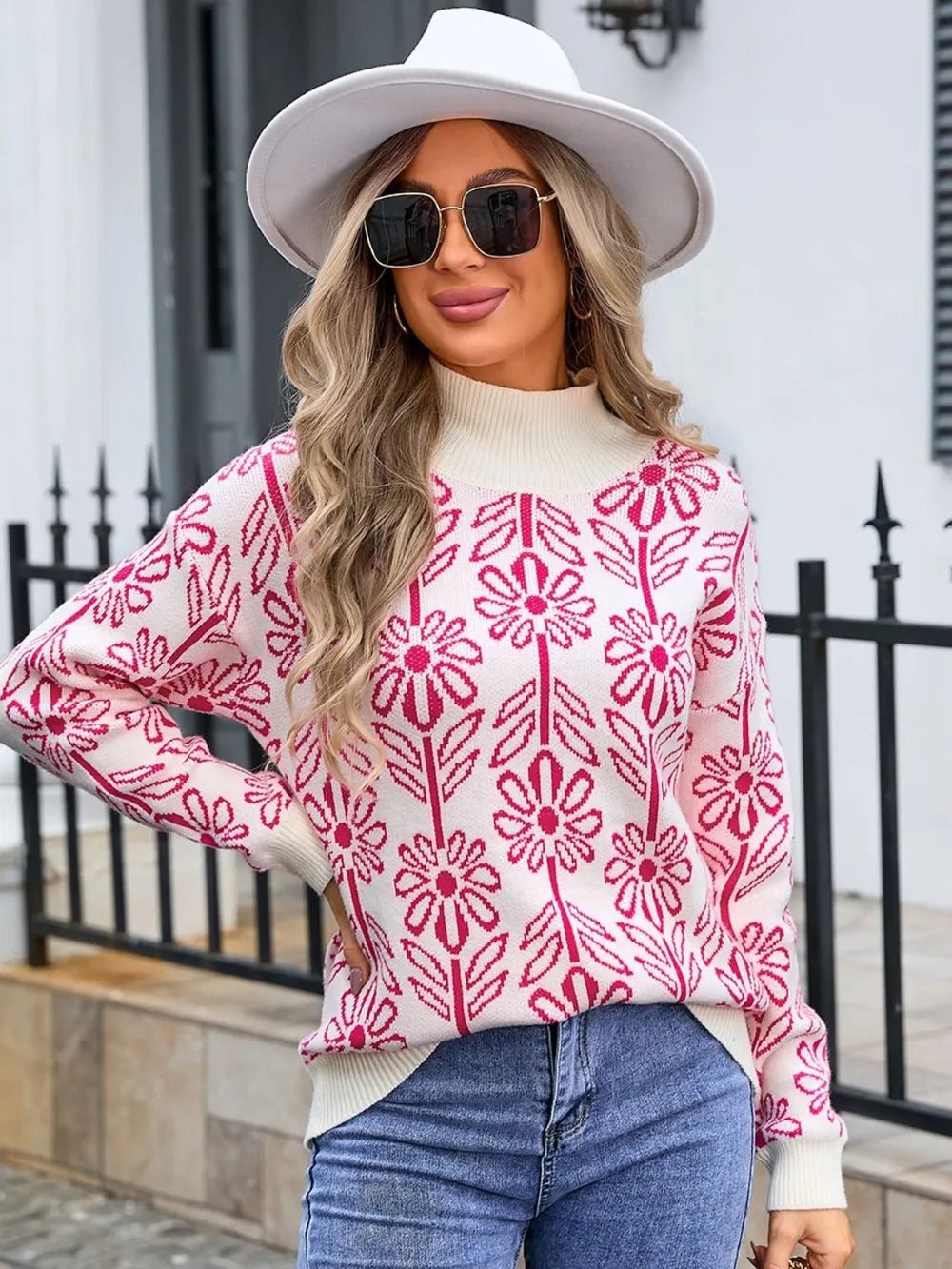 Women’s deep red and white floral turtleneck long sleeve sweater with allover flower pattern.