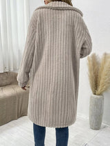 Women’s apricot textured button-down longline outerwear with pockets styled with a cream top and jeans