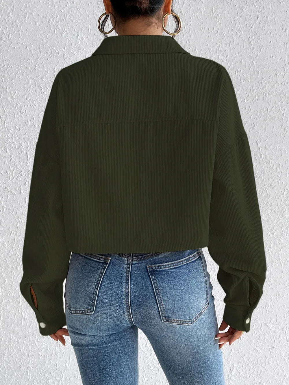 Woman wearing the Honey Snap Down Long Sleeve Jacket in army green with blue jeans and a white top, lightweight women's fall jacket from Chic Mystik Boutique.