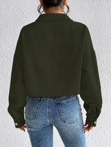 Woman wearing the Honey Snap Down Long Sleeve Jacket in army green with blue jeans and a white top, lightweight women's fall jacket from Chic Mystik Boutique.