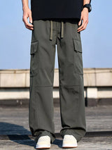 Men’s army green plus size cargo wide leg pants with drawstring waist and utility pockets, sizes Medium–4XL.