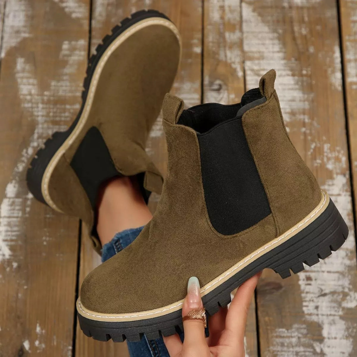 Army green suede round toe Chelsea ankle boots with black elastic side panels, mid-block heels and lug soles.