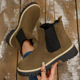 Army green suede round toe Chelsea ankle boots with black elastic side panels, mid-block heels and lug soles.