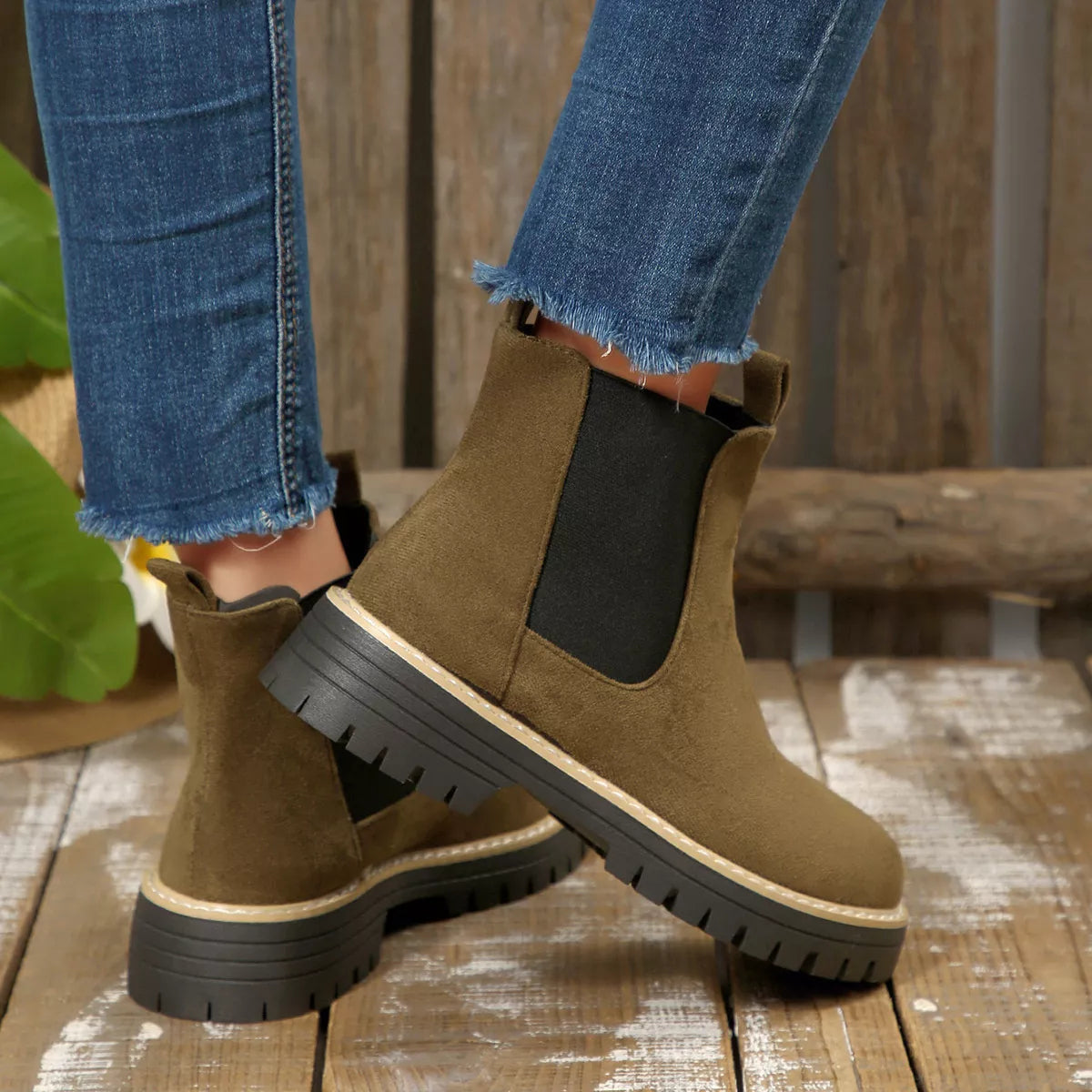 Army green suede round toe Chelsea ankle boots with black elastic side panels, mid-block heels and lug soles.