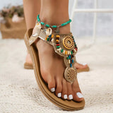 Decorative sandal with colorful beads on a neutral background
