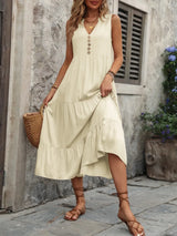 Woman wearing the Ivy Lane decorative button sleeveless dress with a notched neckline and a flattering silhouette.