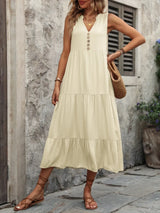 Woman wearing the Ivy Lane decorative button sleeveless dress with a notched neckline and a flattering silhouette.