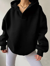 Women's oversized dropped shoulder hoodie sweatshirt in black with long sleeves and relaxed fit, perfect for casual fall outfits, available in 11 colors and sizes Small–2XL.