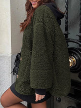 Women's black forest contrast button up sherpa jacket with pockets and long sleeves.