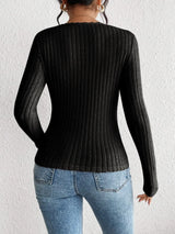 Woman wearing the Honey Ribbed Long Sleeve Sweetheart Neck Top in black with light wash jeans and a black belt, stylish ribbed women's top from Chic Mystik Boutique.