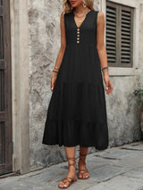 Woman wearing the Ivy Lane decorative button sleeveless dress with a notched neckline and a flattering silhouette.