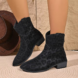 Women's black leopard print western ankle boots with subtle animal print, pointed toes and low block heels.