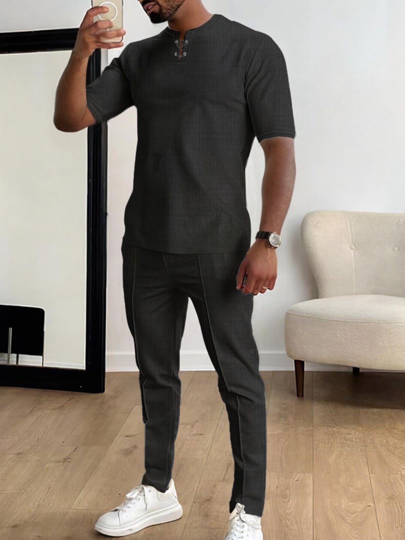 Men's black short-sleeve top and matching pants two-piece casual set with white sneakers, available in sizes Small–3XL.
