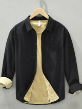 Men’s black plus size button-up long sleeve cotton shirt with chest pocket and contrasting light interior, available in sizes Medium through 3XL.
