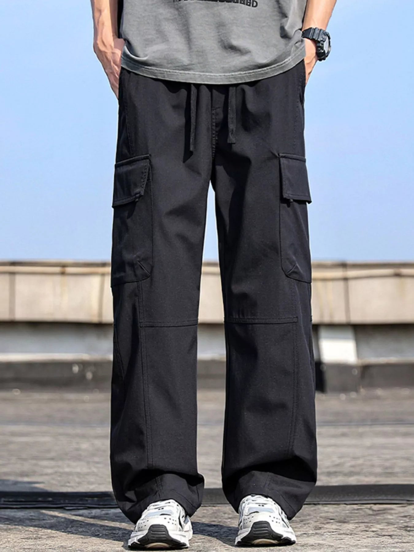 Men’s black plus size cargo wide leg pants with drawstring waist and utility pockets, sizes Medium–4XL.