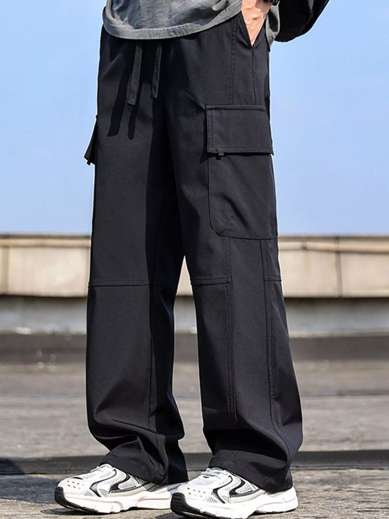 Men’s black plus size cargo wide leg pants with drawstring waist and utility pockets, sizes Medium–4XL.