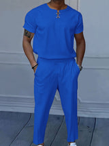 Men's blue short-sleeve top and matching pants two-piece casual set with white sneakers, available in sizes Small–3XL.