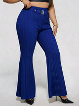 Model wearing blue plus-size high-waisted flare pants styled with pointed-toe heels for an elegant and sophisticated look.