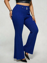Model wearing blue plus-size high-waisted flare pants styled with pointed-toe heels for an elegant and sophisticated look.