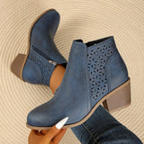 Women’s point toe block heel ankle boots with perforated side detail in blue.