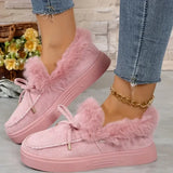 Pink fuzzy sneakers worn with denim jeans on a light background