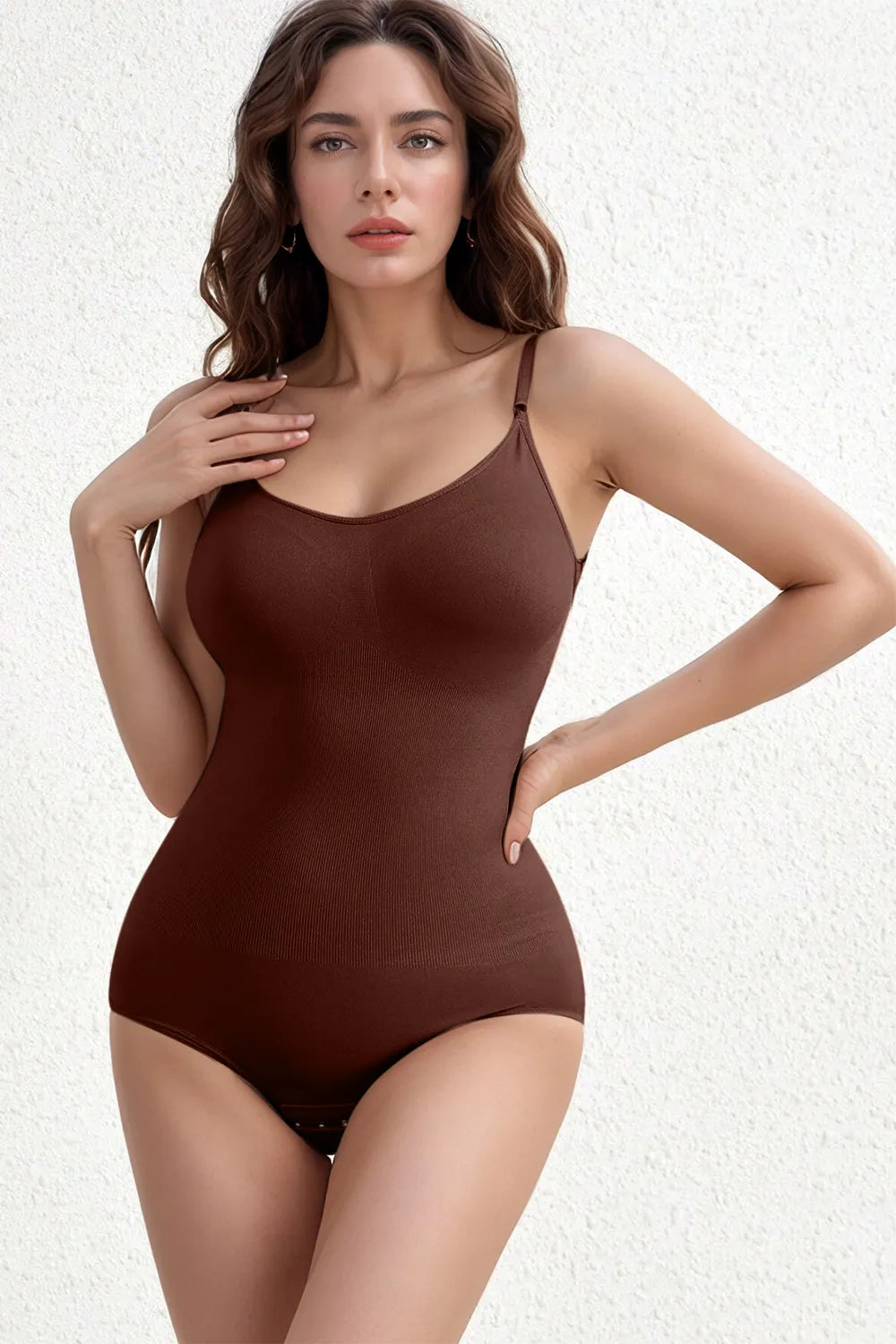 Three Basic Bae scoop-neck butt-lifting bodysuits in black, brown, and dust storm, featuring a smoothing silhouette and comfortable stretch fabric.