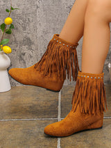 Brown suede ankle boots featuring layered fringe and silver stud detailing around the ankle with a comfortable low heel.