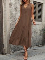 Woman wearing the Ivy Lane decorative button sleeveless dress with a notched neckline and a flattering silhouette.