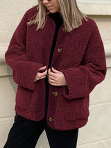Women's burgundy contrast button up sherpa jacket with pockets and long sleeves.