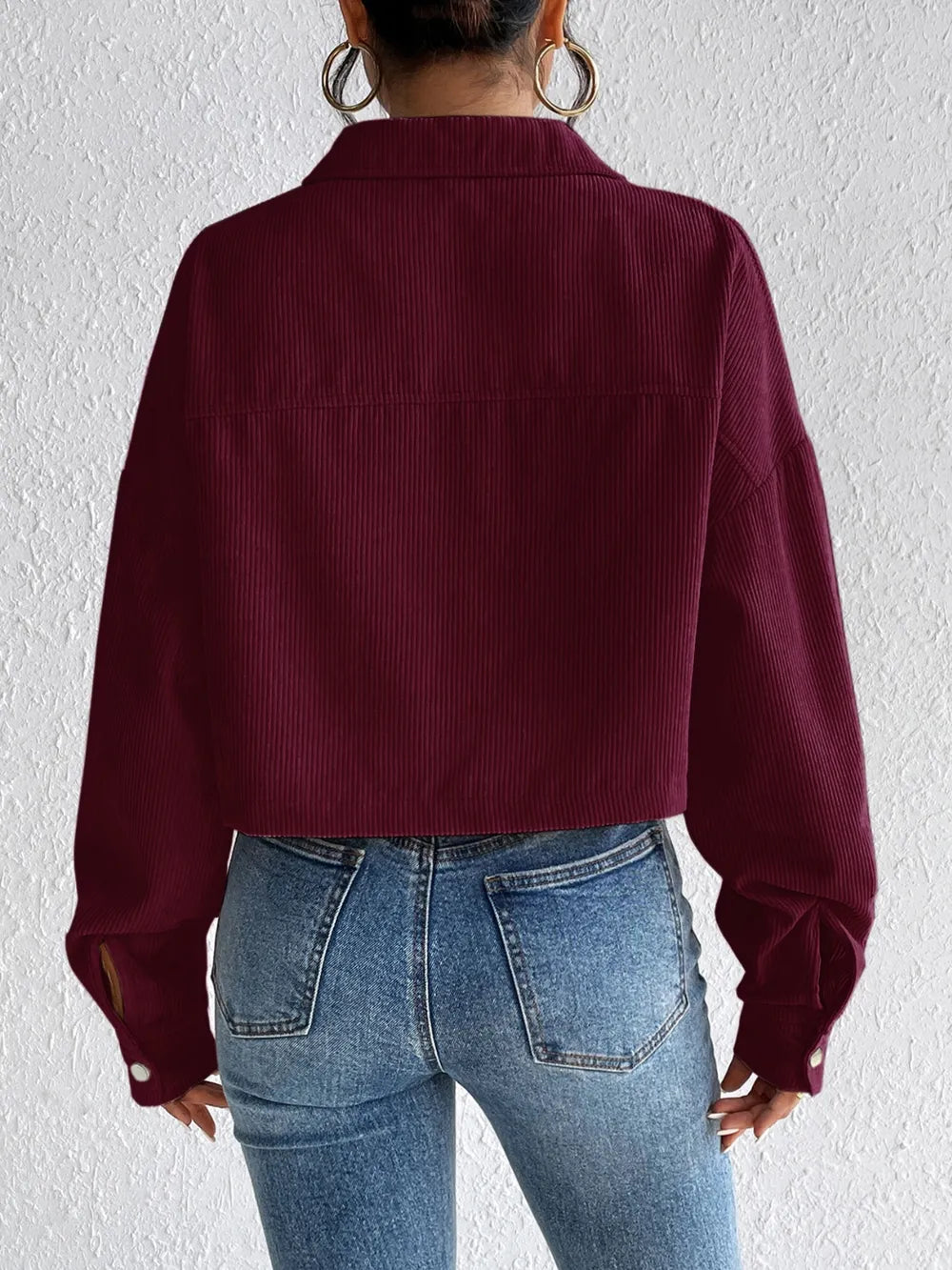 Woman wearing the Honey Snap Down Long Sleeve Jacket in burgundy with blue jeans and a white top, lightweight women's fall jacket from Chic Mystik Boutique.