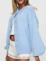 Women's blue button-down knit cardigan featuring a ribbed crew neckline, long sleeves, and relaxed fit. Cozy boutique sweater perfect for layering with jeans, dresses, or casual fall outfits.