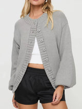 Women's gray button-down knit cardigan featuring a ribbed crew neckline, long sleeves, and relaxed fit. Cozy boutique sweater perfect for layering with jeans, dresses, or casual fall outfits.