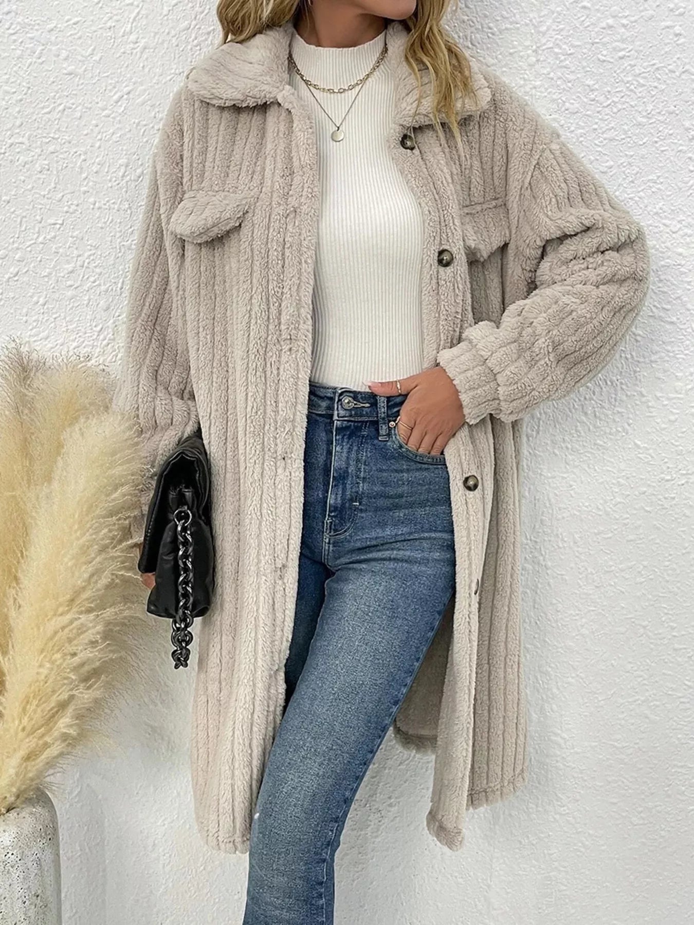 Women’s apricot textured button-down longline outerwear with pockets styled with a cream top and jeans