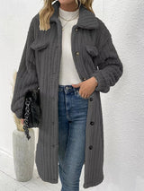 Women’s dark gray textured button-down longline outerwear with pockets styled with a cream top and jeans