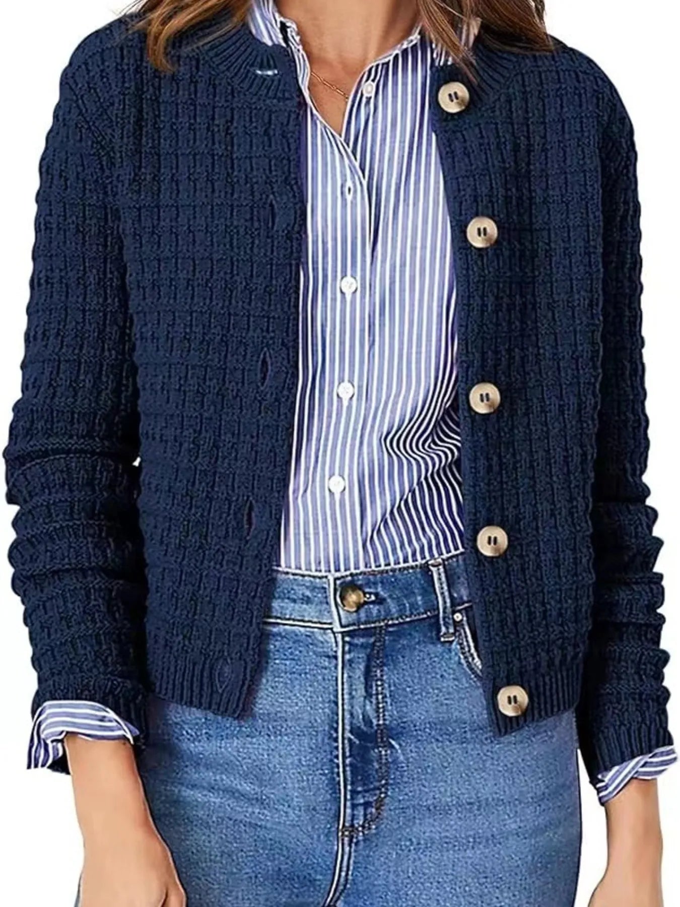 Women's button-up cable-knit cardigan in dark navy with long sleeves and textured knit, styled with denim for a classic fall outfit, available in sizes Small–2XL.