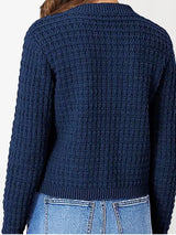 Women's button-up cable-knit cardigan in dark navy with long sleeves and textured knit, styled with denim for a classic fall outfit, available in sizes Small–2XL.