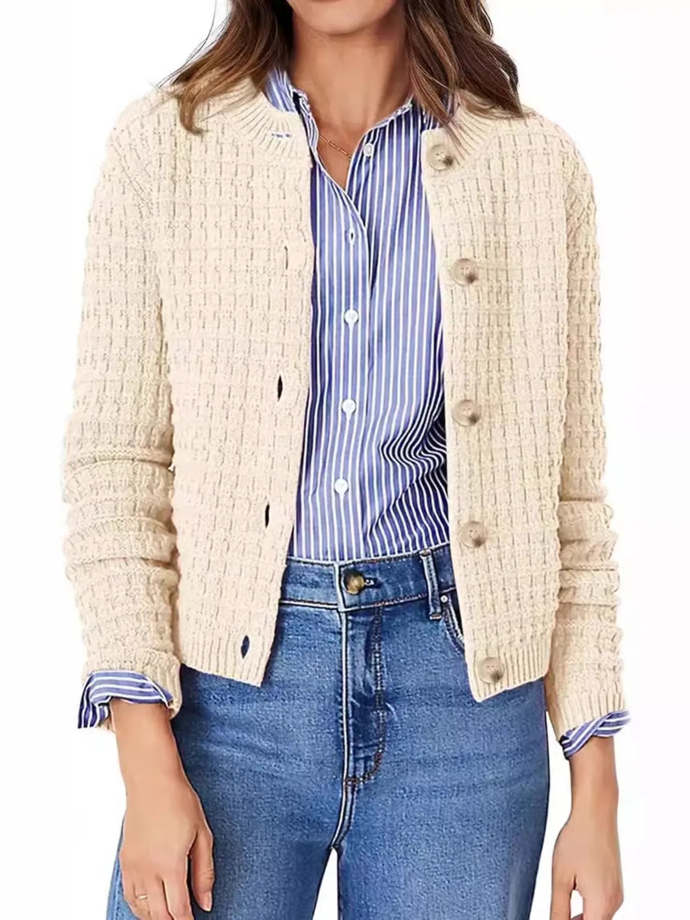 Women's button-up cable-knit cardigan in tan with long sleeves and textured knit, styled with denim for a classic fall outfit, available in sizes Small–2XL.