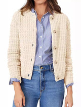 Women's button-up cable-knit cardigan in tan with long sleeves and textured knit, styled with denim for a classic fall outfit, available in sizes Small–2XL.