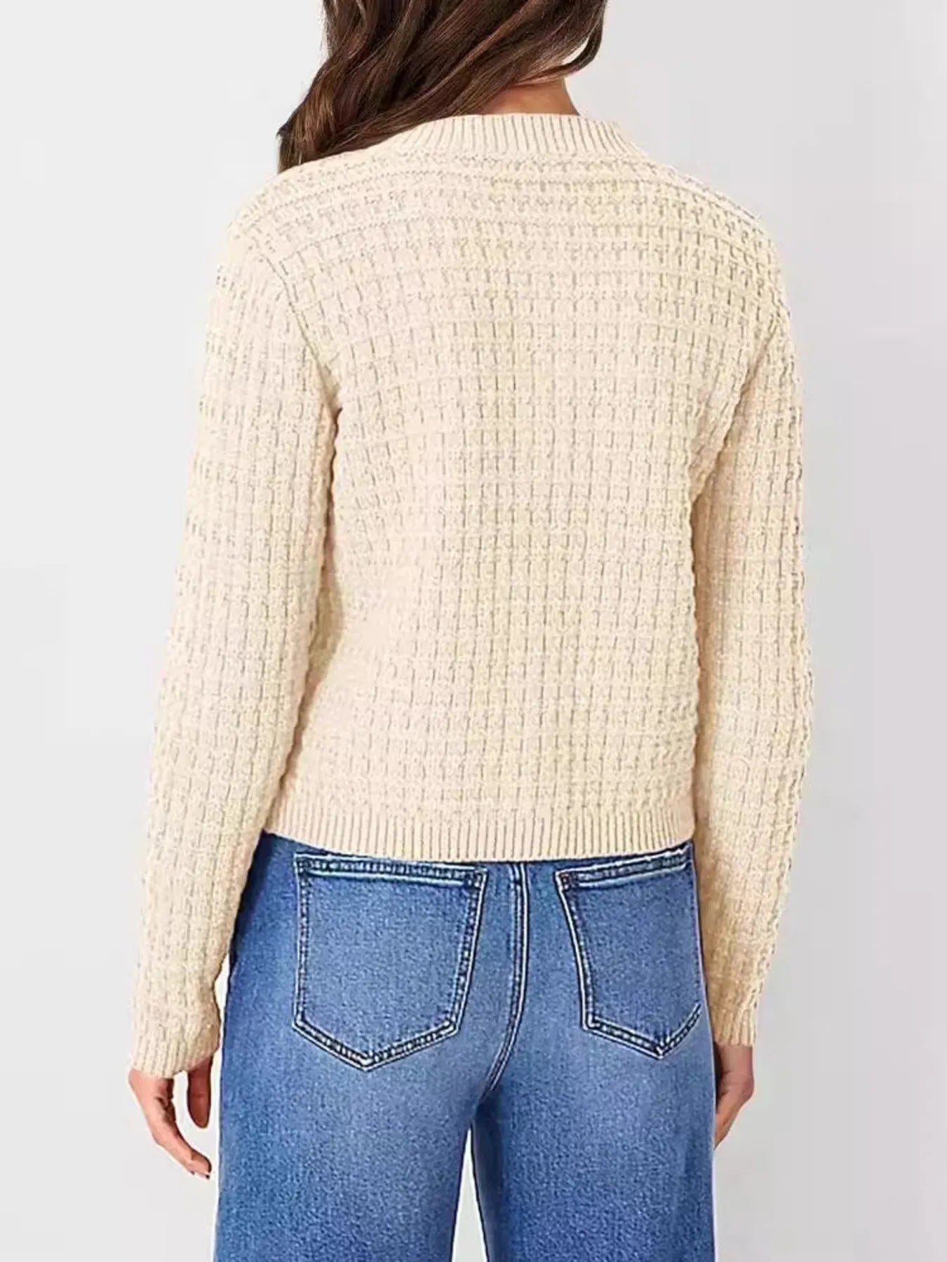 Women's button-up cable-knit cardigan in tan with long sleeves and textured knit, styled with denim for a classic fall outfit, available in sizes Small–2XL.