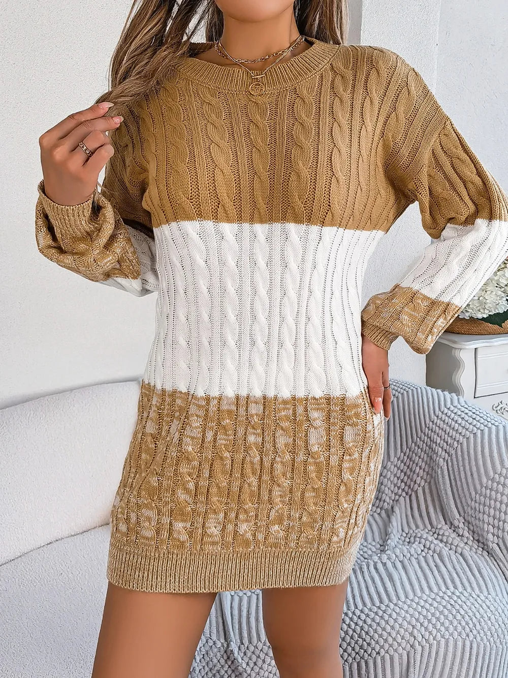 Women's camel cable-knit round neck color block sweater dress featuring long sleeves and cozy textured knit.