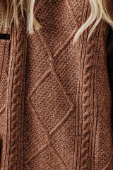 Woman wearing a taupe cable knit long sleeve sweater dress styled with knee-high brown boots and layered gold necklaces.