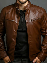 Men’s caramel PU leather motorcycle jacket with zipper front, stand collar and zippered chest pockets, available in sizes Small–5XL.