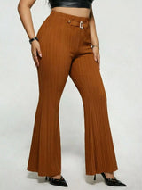 Model wearing caramel plus-size high-waisted flare pants styled with pointed-toe heels for an elegant and sophisticated look.