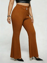 Model wearing caramel plus-size high-waisted flare pants styled with pointed-toe heels for an elegant and sophisticated look.