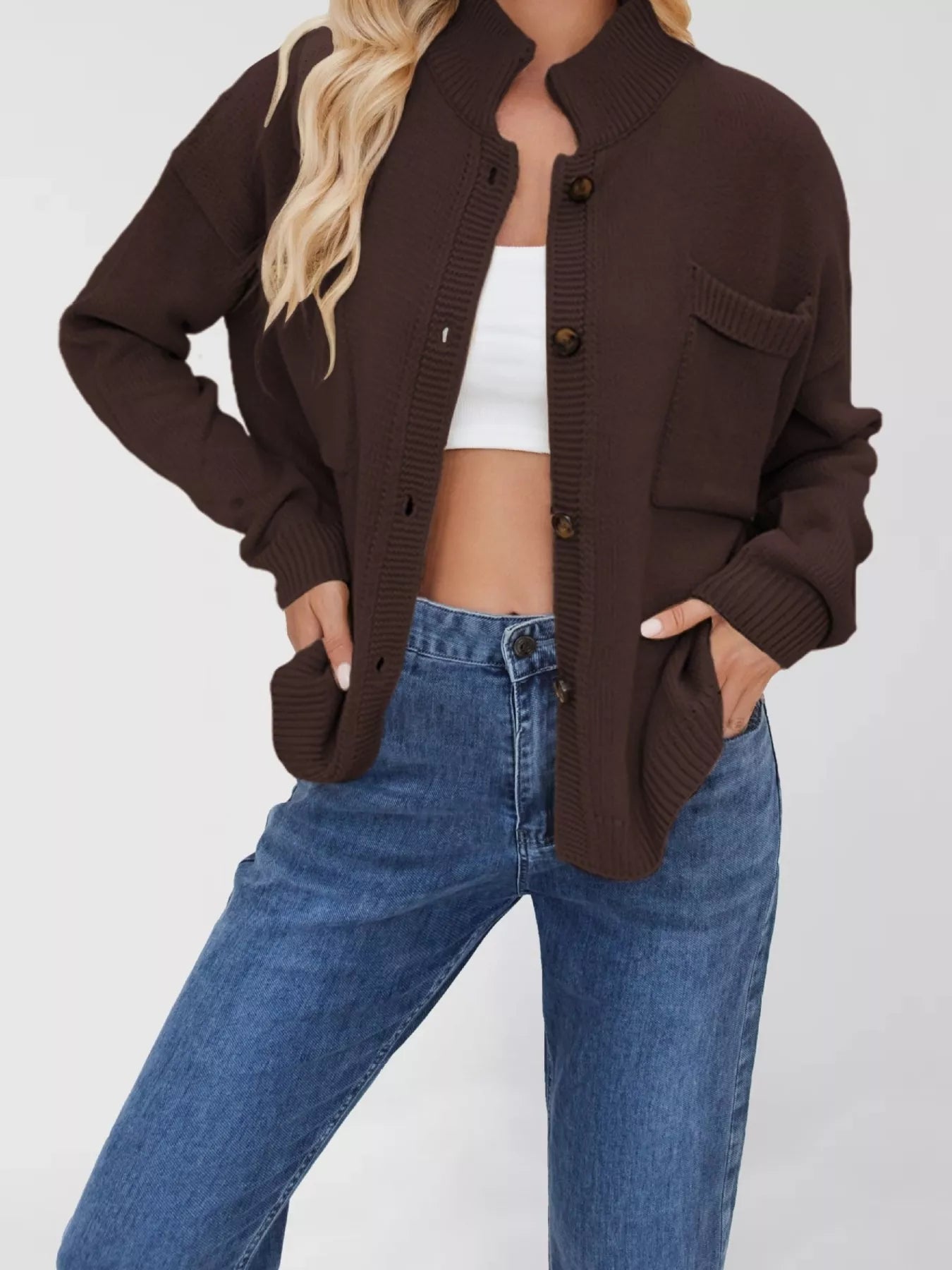 Women's casual knit button-down cardigan in brown featuring a stand collar, chest pocket, front pockets, and ribbed trim. Cozy boutique sweater perfect for layering with jeans and fall outfits.