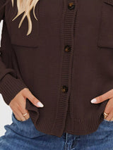 Women's casual knit button-down cardigan in brown featuring a stand collar, chest pocket, front pockets, and ribbed trim. Cozy boutique sweater perfect for layering with jeans and fall outfits.