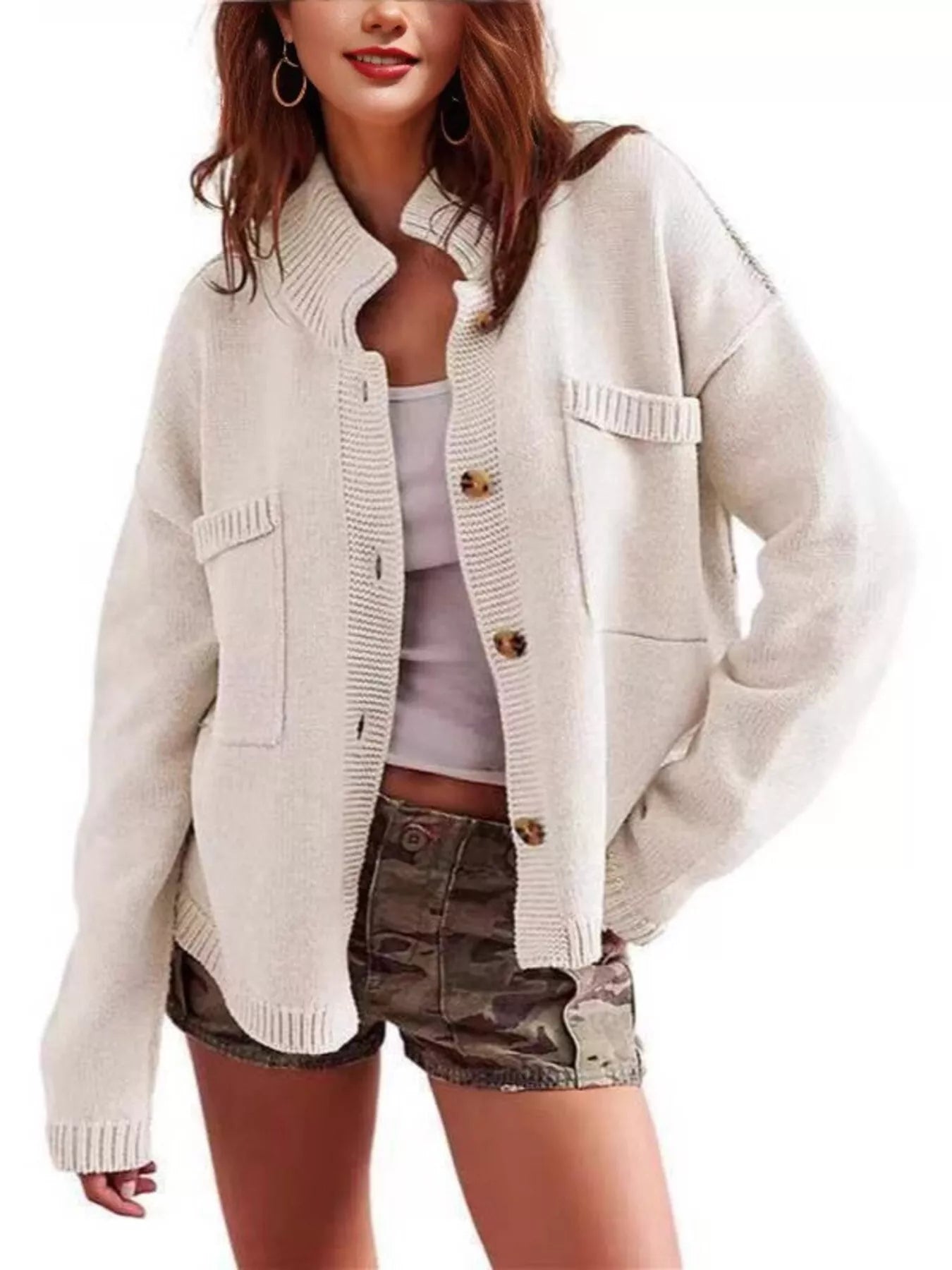 Women's casual knit button-down cardigan in ivory featuring a stand collar, chest pocket, front pockets, and ribbed trim. Cozy boutique sweater perfect for layering with jeans and fall outfits.